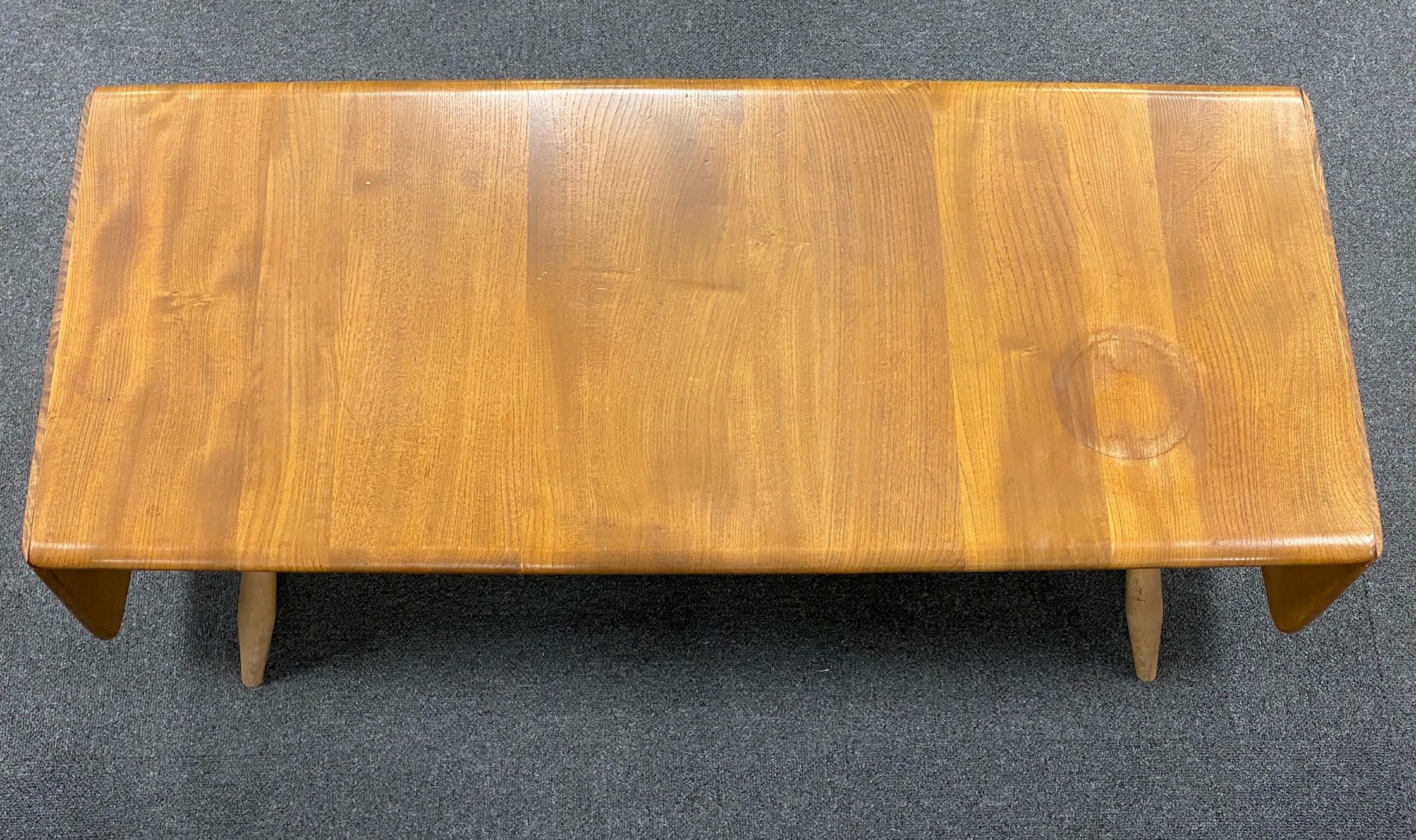 An Ercol elm drop flap coffee table, length 106cm, depth 45cm, height 36cm